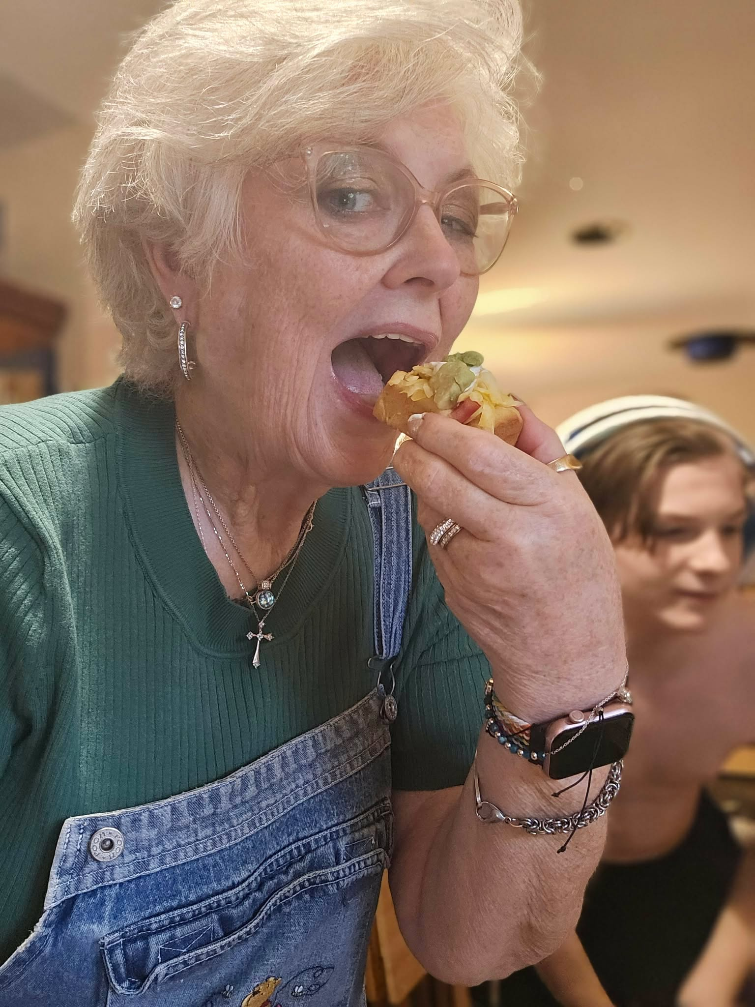 Lissa taste-testing a Crispy Taco Bite